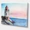 Designart - A Lighthouse On A Rock Shore In Early Morning - Nautical & Coastal Canvas Wall Art Print